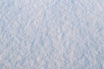 Background with snow texture, snow surface on a sunny day