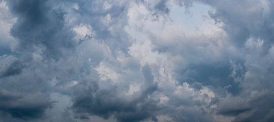 Fototapeta na wymiar Dramatic sky with dark dense clouds before a thunderstorm