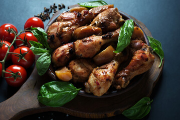 Chicken legs baked with apples in soy sauce and spices. Homemade food