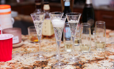 Plastic cups at a lively party embody celebratory spirit, casual socializing, and youthful exuberance, symbolizing carefree moments and camaraderie