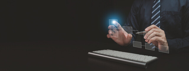 Person with hologram flowchart, businessman designing flowchart business workflow to systematically qualitatively, flowcharting to visualize the workflow of the program. Flowchart design concept.