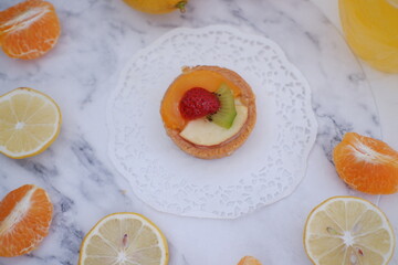 Fruit tartlet with orange, kiwi, strawberry and mandarin