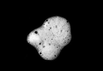 liquid white foam from soap or shampoo or shower gel Abstract soap bubbles. Set foam, soap bubble isolated on black, with clipping path texture and background.
