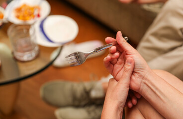 Hands and utensils gather around, embracing the communal spirit of a potluck dinner. Symbolizing unity, sharing, and indulgence as they enjoy a variety of desserts