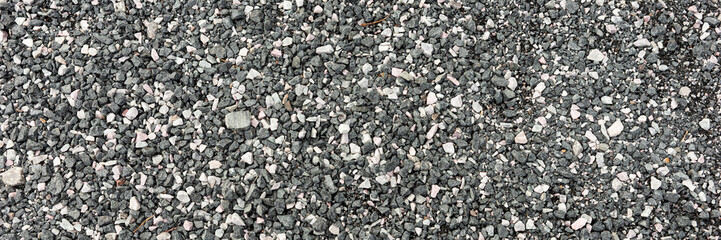 Gray and white pebble stones as background. Panorama
