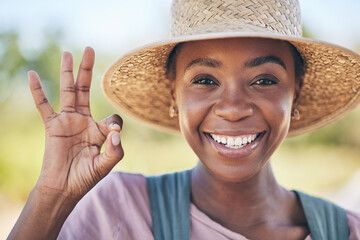 Smile, okay hand sign and portrait of black woman on farm with sustainable business, nature and...