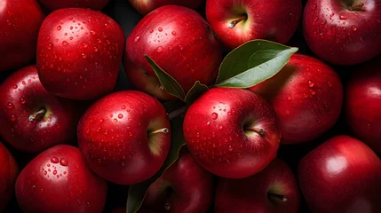 Fotobehang Red apples with leaves, closeup with top view, Red apple patterns, Top view of bright ripe fragrant red apples with water drops as background © ImaginaryInspiration