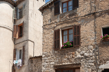Old stone residential building in street in ancient town