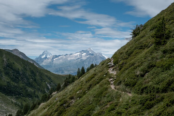 Fototapeta na wymiar Hiking in the wonderful mountains to observe high peaks