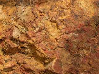 the surface of the old stone, close-up, rock pattern to be used as a background image in advertisements, brochures, the Internet.