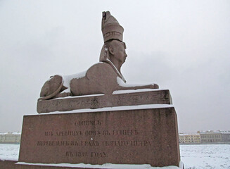 Winter landscape with an ancient Egyptian sphinx in St. Petersburg, Russia. Ancient sculpture is...