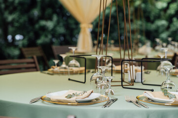 Open air wedding restaurant decorated with fresh flowers and premium dishes