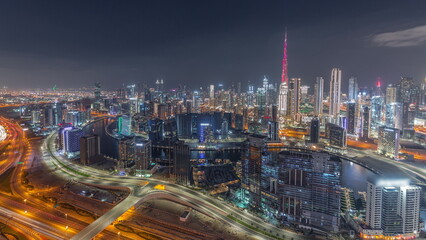 Fototapeta na wymiar Skyline with modern architecture of Dubai business bay towers day to night timelapse. Aerial view