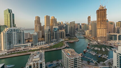 Panorama showing Dubai Marina skyscrapers and JBR district with luxury buildings and resorts aerial timelapse