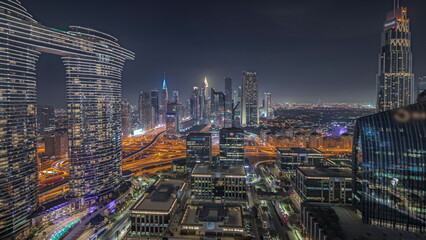 Panorama showing futuristic Dubai Downtown and finansial district skyline aerial night timelapse.