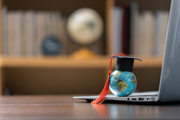 Graduation cap with Earth globe. Concept of global business study, abroad educational, Back to...