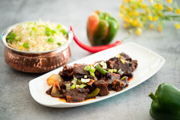 Delicious beef stir-fry with red and yellow bell peppers