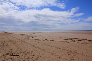 The view of the Formby Beach (Victoria Road Beach) or Formby Dunes in Liverpool, UK at sunny day. City in Merseyside county of North West England. Including the famous sand dunes. Nature, travel scene