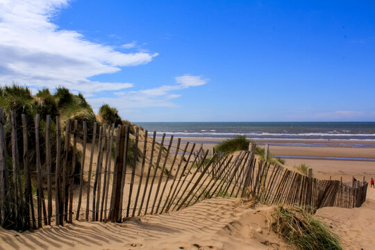 The view of the Formby Beach (Victoria Road Beach) or Formby Dunes in Liverpool, UK at sunny day. City in Merseyside county of North West England. Including the famous sand dunes. Nature, travel scene