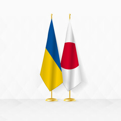 Ukraine and Japan flags on flag stand, illustration for diplomacy and other meeting between Ukraine and Japan.