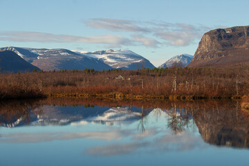 Mountains near Kebnekaise, Sweden, in october, clear sky, snowcapped peak, reflection on the lake