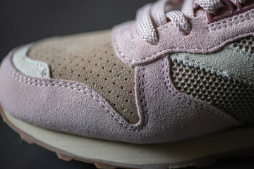 Fragment of original suede sports sneakers.