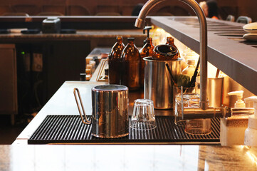 Cafe equipment pitcher stainless steel with measuring glass.