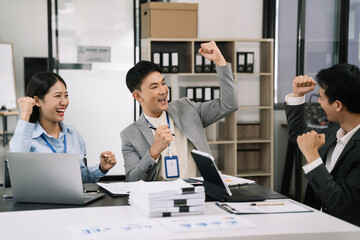 Happy smiling businessman feel happy work complete Teamwork success, success at work in the office concept.