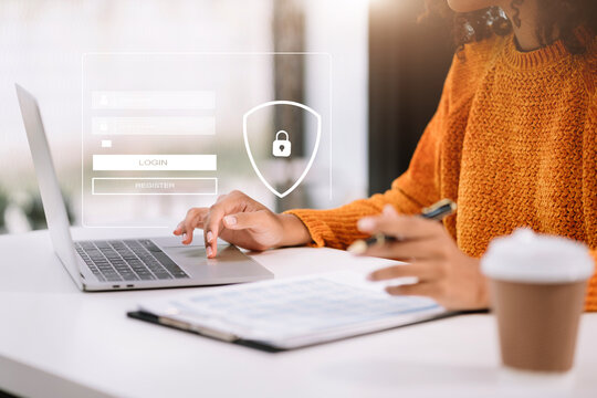 Businessman typing login and password in the concept of cyber security, information security, data protection, and encryption for secure access to user's personal information.