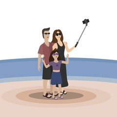 The family is photographed on the beach with the sea