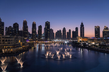 Fototapeta na wymiar Unique view of Dubai Dancing Fountain show at night. 