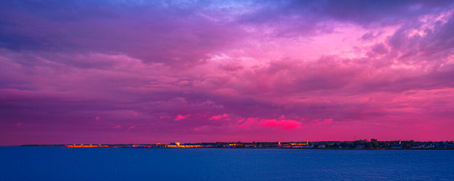 Summerside Sunrise Seascape over Miscouche Bank of Gulf of St Lawrence in Prince Edward Island, Canada, dramatic cloudscape over the horizono