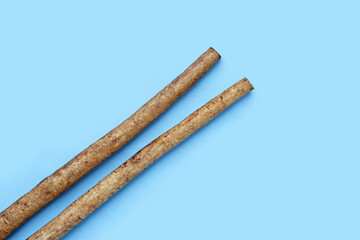 Burdock Root (Gobo) on blue background.