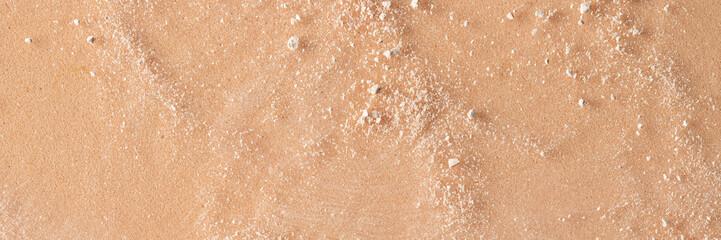 Abstract beige crashed shimmer powder texture on beige background for cosmetuc banner. Copy space