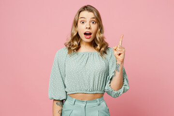 Young insighted smart proactive woman she wear casual clothes look camera holding index finger up...