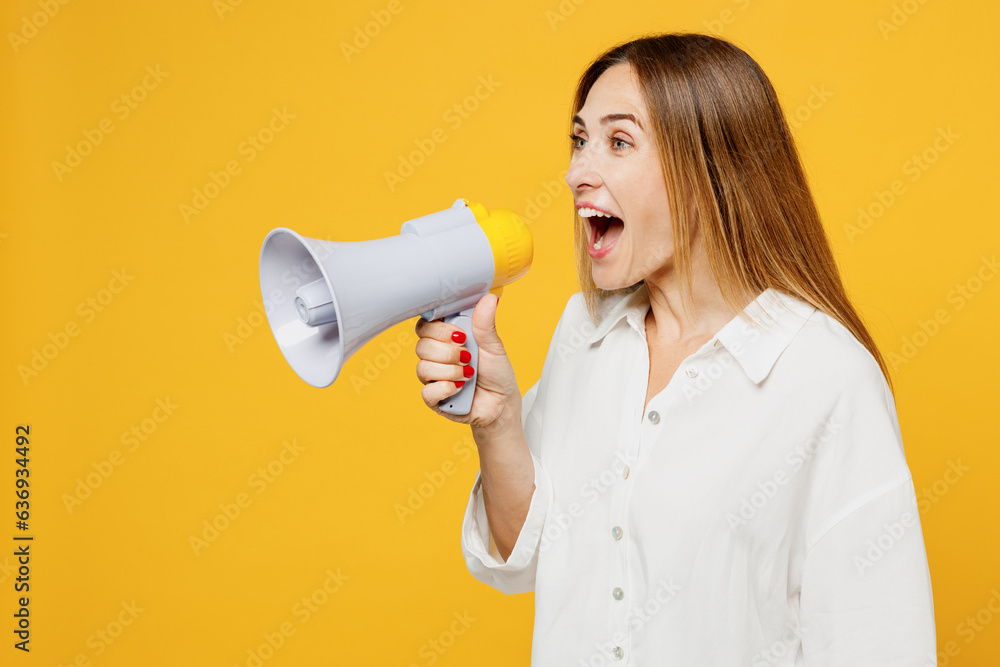 Wall mural young surprised happy woman she wears white shirt casual clothes hold in hand megaphone scream annou