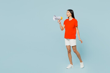 Full body fun young latin woman she wear orange red t-shirt casual clothes hold in hand megaphone...
