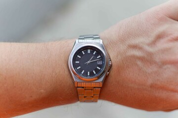 A chrome colored watch