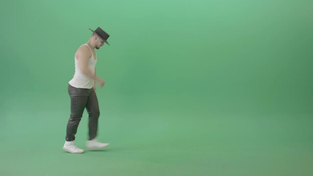Man makes moonwalk and dancing Pop isolated on Green Screen