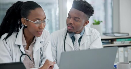 Laptop, discussion and doctors in an office in the hospital for a diagnosis treatment plan. Healthcare, conversation and African medical workers talking and doing research on a computer in a clinic.