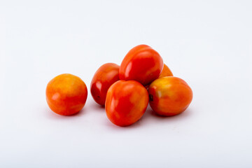 The popular fruit of America. Organic tomatoes on the white background.