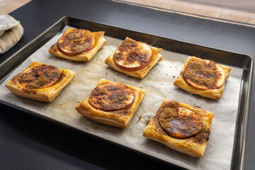 Puff pastry apple tarts  on black background.food concept. dessert. bakery