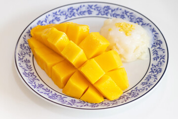 Thai sweet sticky rice with mango. Thai style tropical dessert, glutinous rice eat with mango.