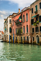 Fototapeta na wymiar Photo of Venice's iconic waterfront with a picturesque row of buildings reflected in the tranquil waters