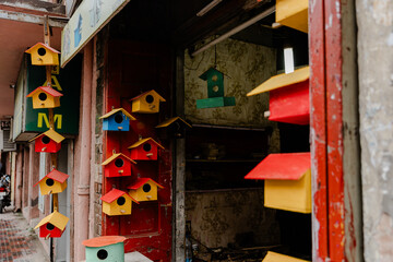 Multi-coloured bright wooden birdhouses set
