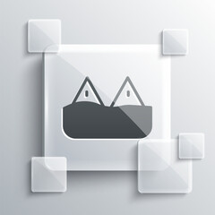 Grey Whale tail in ocean wave icon isolated on grey background. Square glass panels. Vector