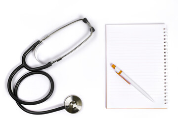 Doctor desk.Stethoscope notebook and pen on white background