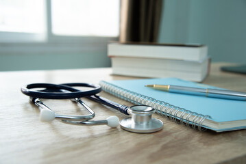 In a hospital setting, the presence of a doctor's physician book and stethoscope carries with it an...