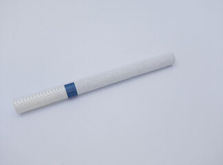 Close-up of a cigarette isolated on white background