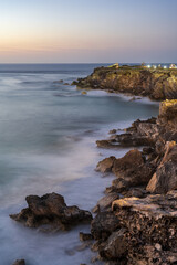 morning light on rocky cliff ocean 